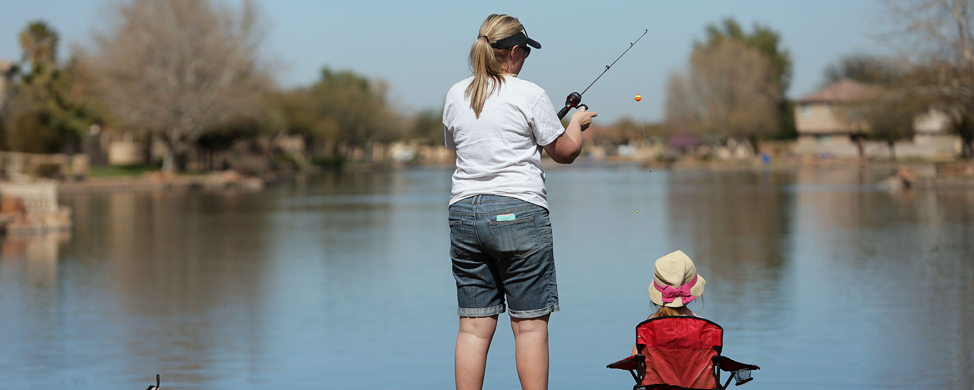 Woman and child fishing