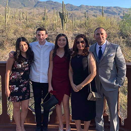 Family with cactuses in the background