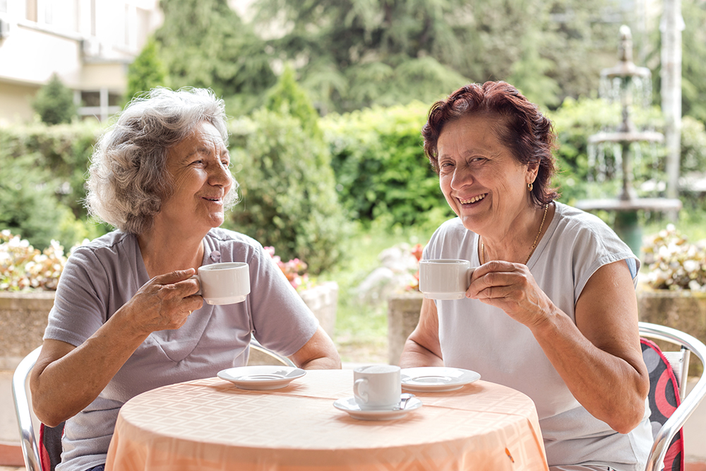 Two older women having coffee