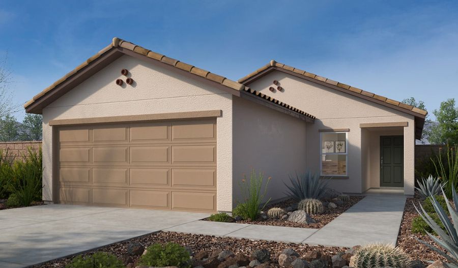 Single-story beige house with a brown tiled roof, double garage, small front porch, and desert landscaping featuring rocks and drought-tolerant plants under a clear blue sky.
