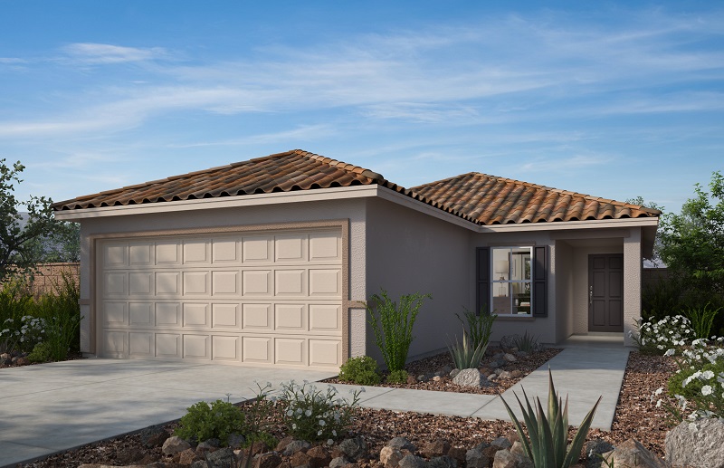 A single-story house with a tan exterior, red-tiled roof, double garage, and a small front yard landscaped with rocks and desert plants under a blue sky.