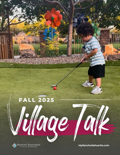 A young boy playing mini-golf outside on a green lawn, aiming at a red ball with a putter. Colorful pinwheels and trees are in the background. Text reads “Fall 2025 Village Talk.”.