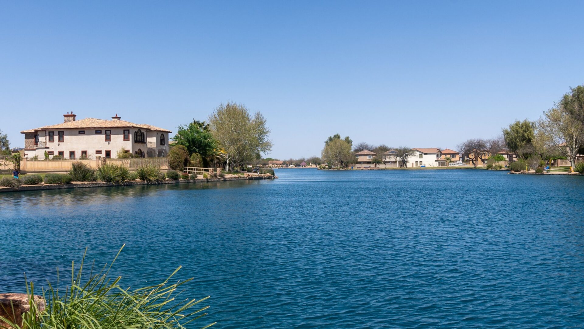 Scenic waterfront homes and peaceful neighborhood lake view highlighting the commute from Sahuarita and the lifestyle benefits of living near Tucson suburbs